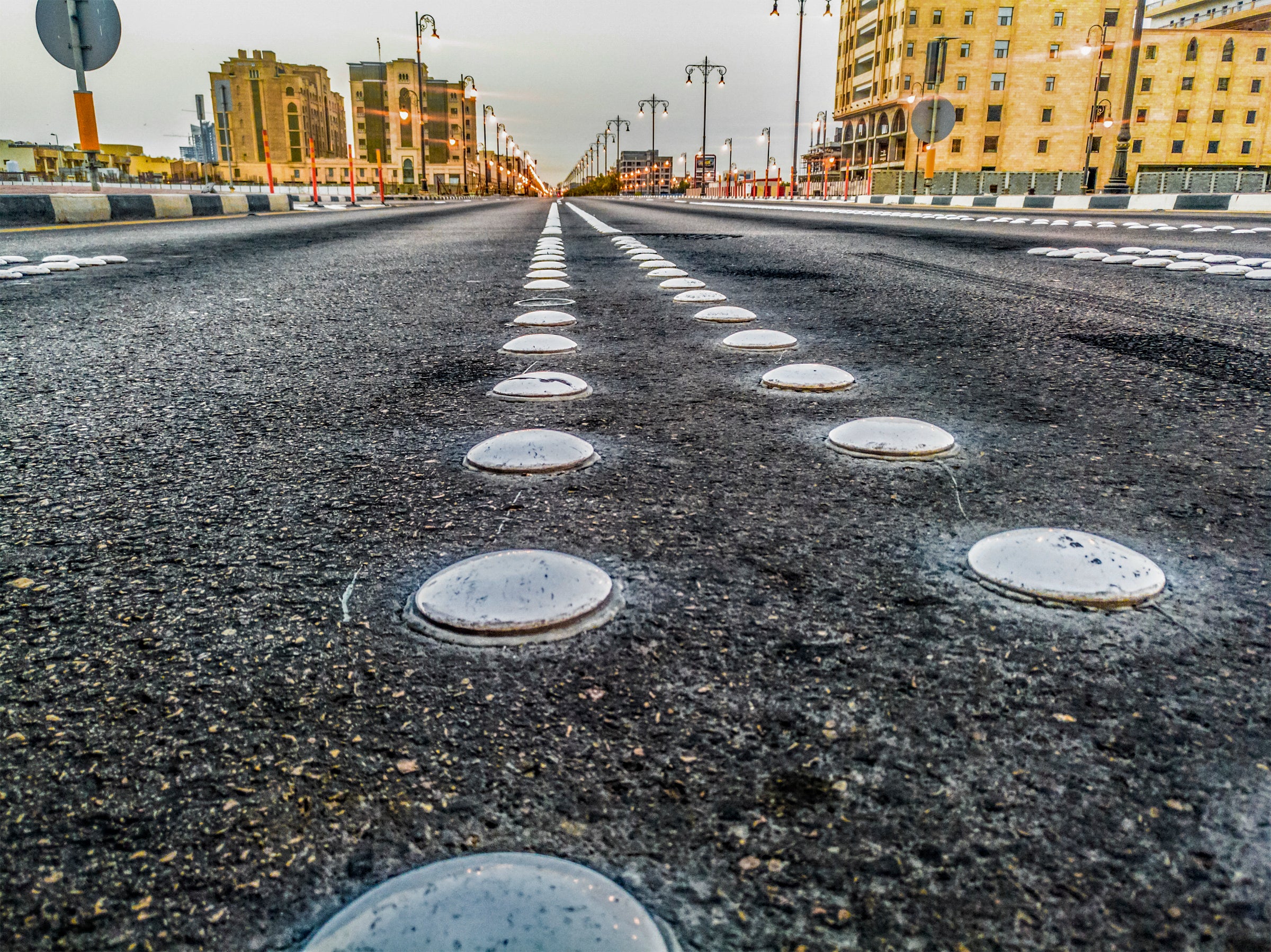 White Pavement Markers on a City Street Image