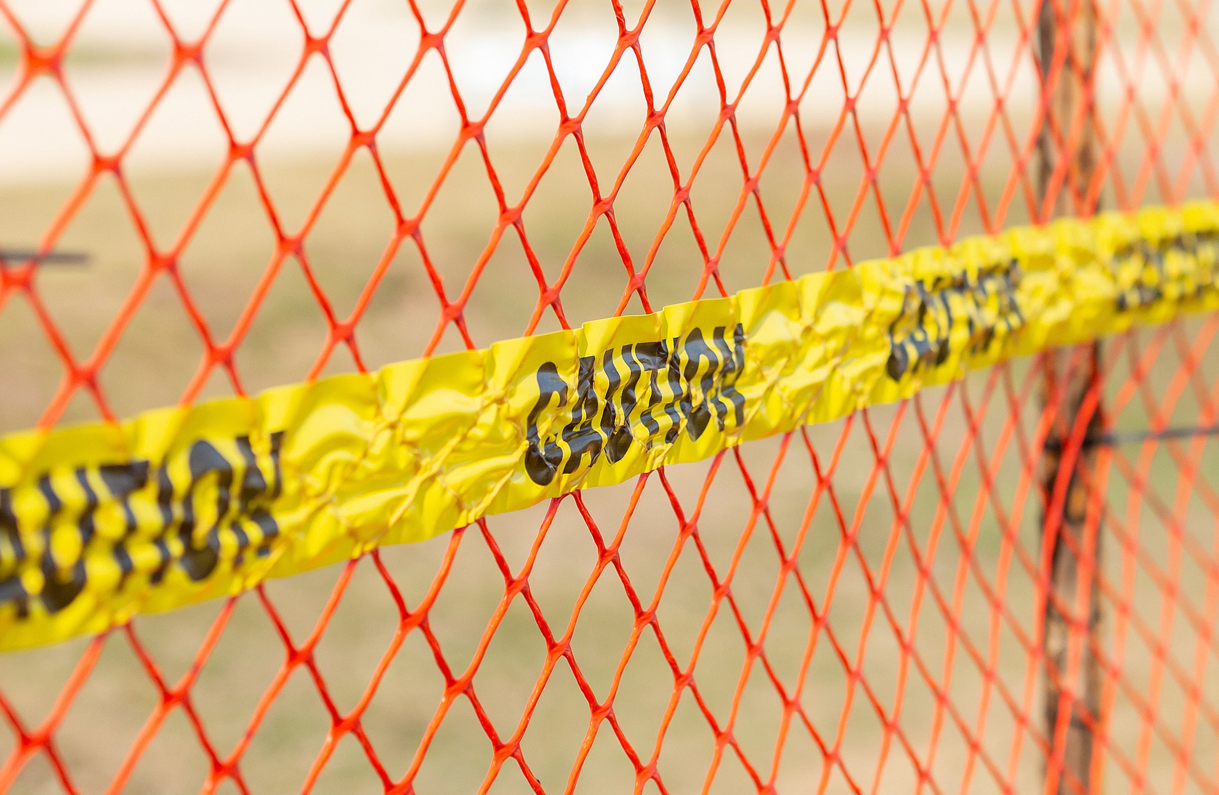 Safety Fencing in Orange and Caution Tape Image