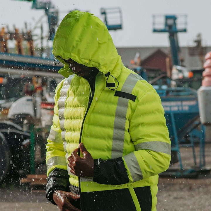 Hi-Vis Quilted Safety Parka With Hood Yellow Front View In Use Construction Site Secondary Image