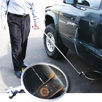 Inspection Mirror In Use Under Car Image