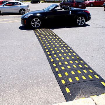 Safety Rider Rubber Speed Bumps with End Cap Spanning Road Image