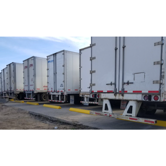 Truck Parking Stop Blocks In Use at 18-Wheeler Parking Lot