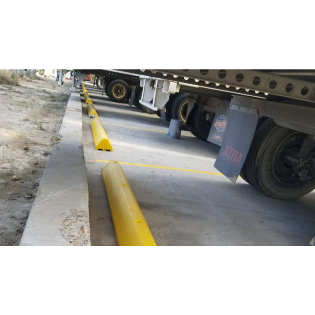 Truck Parking Stop Blocks In Use at Parking Lot Image